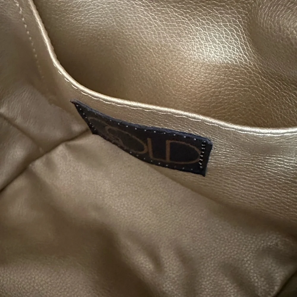 NWT gorgeous gold leather handbag. Detachable shoulder strap. Gold and beige